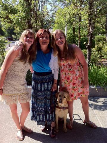 Sherry guide dog Millie and puppy raisers Morgan and Ashley on guide dog graduation day